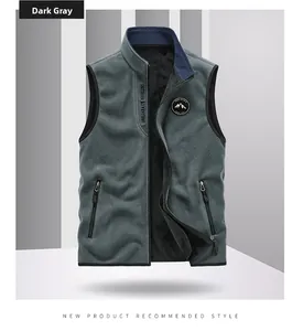 Detail of dark gray fleece vest featuring stand collar, zip pockets and outdoor embroidery