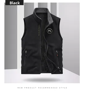 Detail of black fleece outdoor vest showing chest embroidery and stand collar