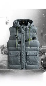 Detail of grey men's padded vest featuring ripstop fabric and yellow utility chest labels