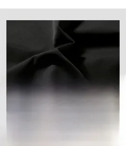 Detailed macro view of the smooth black synthetic jacket fabric with a slight satin sheen