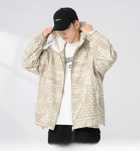 Detail of men's beige paisley print casual hooded jacket with white drawstring and zipper