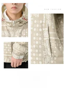 Detail view of khaki paisley hooded jacket showing drawstring hood and velcro adjustable cuffs