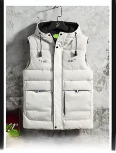 Detail of white hooded vest showing horizontal quilting and TME letter print