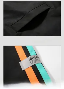 Detail of black sports jacket featuring side pocket and neon stripes with SPORT label