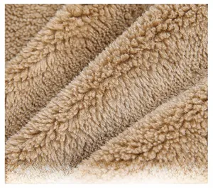 Close-up of warm camel lamb wool lining inside the men's winter jacket