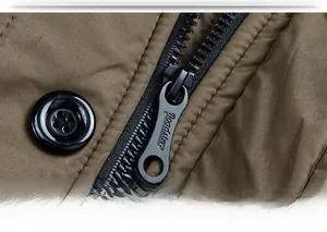 Close-up of quilted winter jacket featuring Roadster embossed metal zipper and button detail