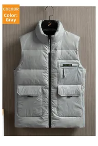 Detail of gray puffer vest featuring a stand collar and three utility flap pockets