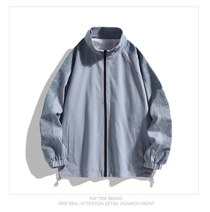 Detail of light blue jacket with paisley patterned sleeves and drawstring hem