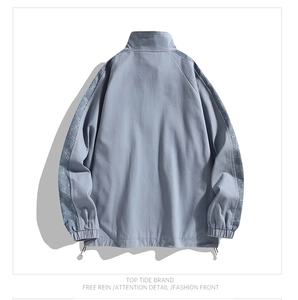 Back view of light blue-grey jacket featuring paisley print sleeves and adjustable drawstring