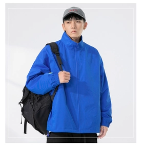 Close-up of royal blue windbreaker jacket with elastic cuffs and full zip closure