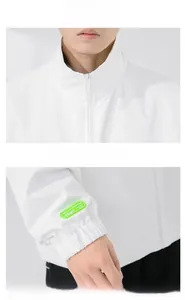 Detail view of white stand collar and fluorescent sleeve label on men casual jacket