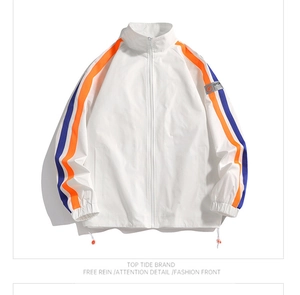 Detail of white stand-collar jacket featuring orange and blue stripes and sport arm patch
