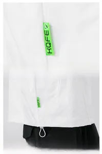 Detail of white casual jacket with neon green KOFE ribbon and adjustable drawstring hem