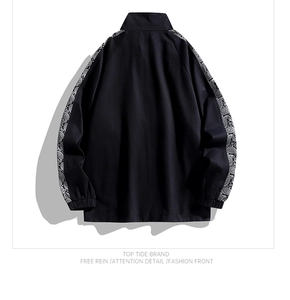 Back view of black stand-collar jacket with paisley pattern stripes on the sleeves