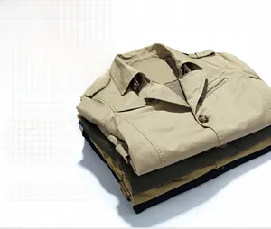 Detail of stacked cotton windbreakers in khaki, army green, and black with stand collar