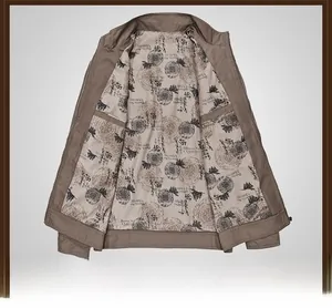 Detail view of khaki jacket interior featuring vintage nautical print and an inner pocket