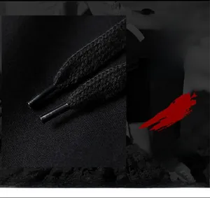 Close-up detail of adjustable drawstring and elastic waistband on black sports joggers