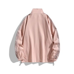 Pink stand-collar jacket with paisley sleeve trim and adjustable drawstring hem