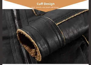 Close-up of black leather jacket cuff with thick brown fleece lining and neat stitching