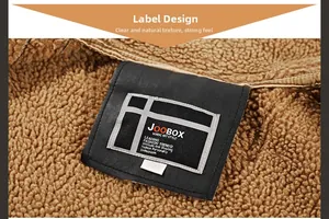 Detailed view of the warm brown shearling fleece lining and black leather collar label