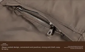 Detailed close-up of a silver metal zipper on a brown textured casual jacket pocket