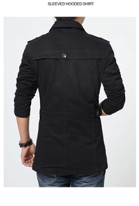 Detail view of the back of a black hooded cotton jacket with shoulder tabs and waist strap