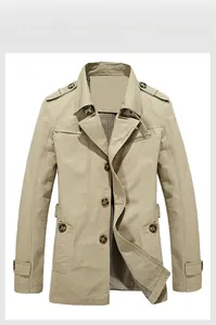 Detail of light khaki cotton trench coat featuring classic plaid lining and stand collar