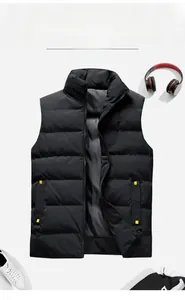 Detail view of men's black puffer vest with stand collar and decorative yellow pocket straps