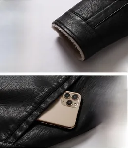 Detail der Herren-Lederjacke mit schwarzer Litschi-Struktur und warmem Lammwollfutter