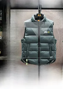 Detail of dark green down vest with high stand-up collar and premium zipper closure