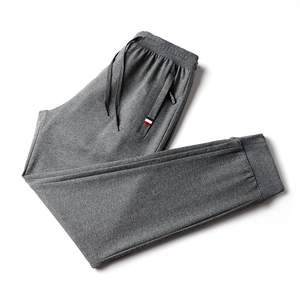 Men's grey slim fit jogger pants with elastic drawstring waist and ribbed cuffs