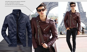 Detail of burgundy biker jacket featuring ribbed sleeve texture and zipper pockets
