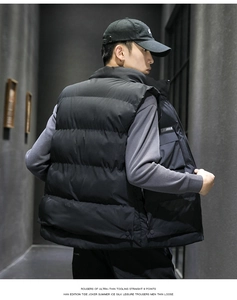 Close-up of black quilted puffer vest for men with high-quality horizontal stitching detail