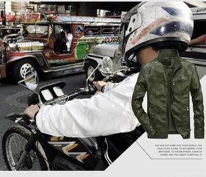 Detail of olive green faux leather biker jacket with quilted shoulders and zipper pockets