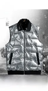 Close-up of silver men's down vest showing metallic fabric and embossed Coexist pattern