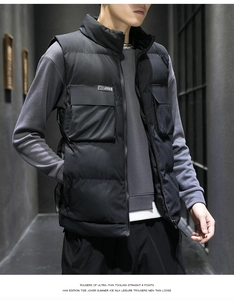 Detailed view of black padded men's workwear vest with stand collar and large front pockets