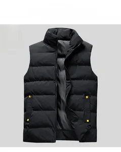 Close-up of black men's puffer vest featuring horizontal quilting and yellow strap details