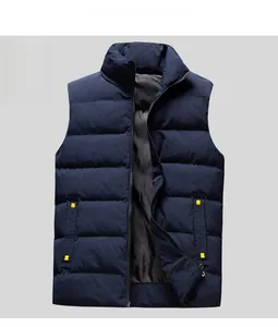 Detail of navy blue quilted vest showing horizontal stitching and yellow pocket accents