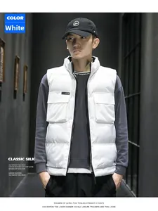 Close-up of white padded vest featuring a stand collar and functional cargo pockets