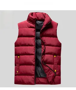 Close-up of a burgundy quilted puffer vest featuring yellow zipper detail and side pockets