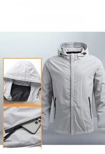 Detail view of light grey hooded windbreaker featuring adjustable drawstring and zipper pockets