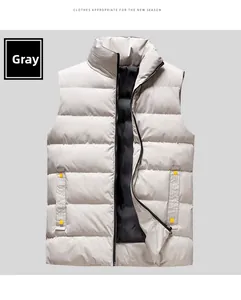 Detail of light gray men's puffer vest with zipper closure and yellow pocket accents