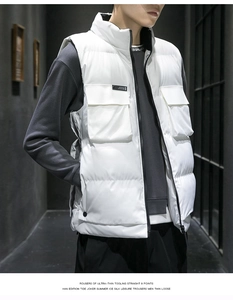 Detail of white quilted vest for men featuring stand collar and large flap pockets