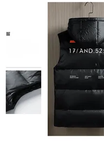 Détail du gilet matelassé noir avec motif graphique bleu AEA et lettrage imprimé au dos