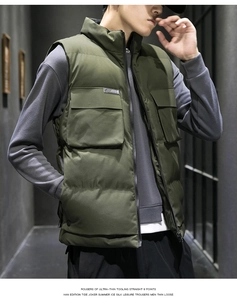 Detail of olive green utility vest showing large cargo pockets and stylish stand collar