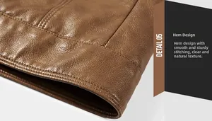 Detail of caramel brown PU leather jacket hem showing precision stitching and litchi texture