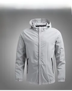 Detailed front view of light gray hooded men's jacket with windproof fabric and zippers
