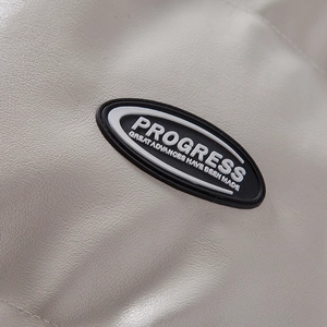 Detailed macro view of the black rubber logo on white faux leather jacket fabric