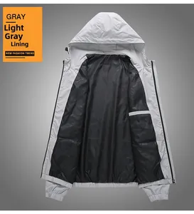 Detail view of light gray windbreaker showing interior pocket and black lining