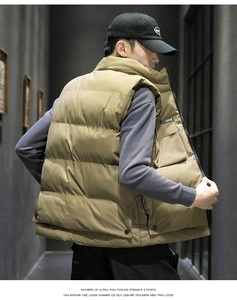 Detail of khaki padded puffer vest with quilted texture and high stand collar for men